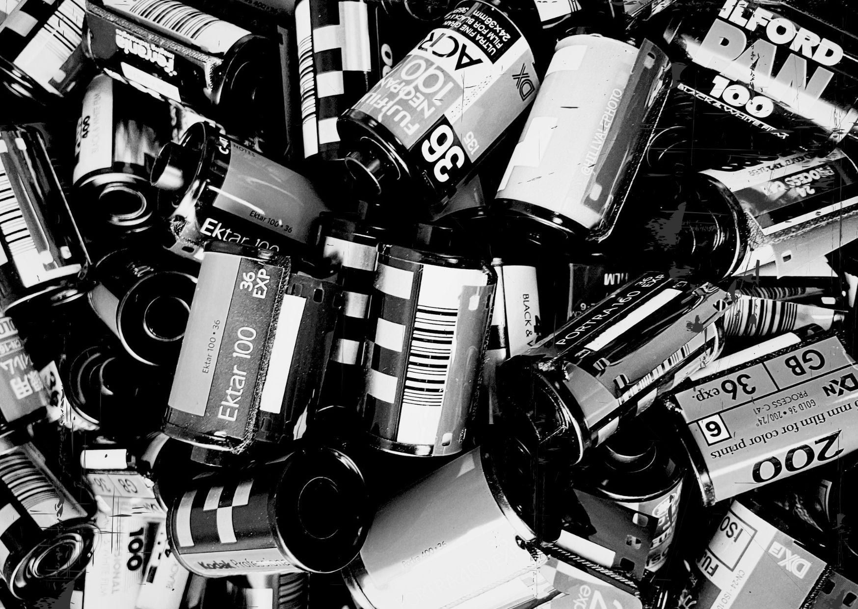 Black and white image of empty 35mm film canisters